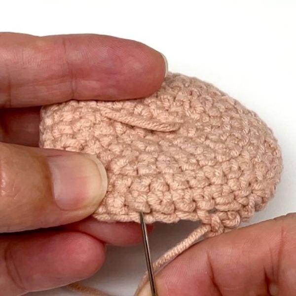 hand showing a crochet stitch